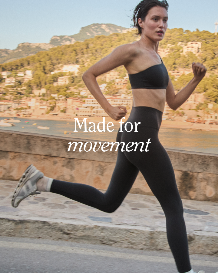 Woman running outdoors in Offshore Top + Super Moves Tight in Jet with 'Made for movement' text overlay
