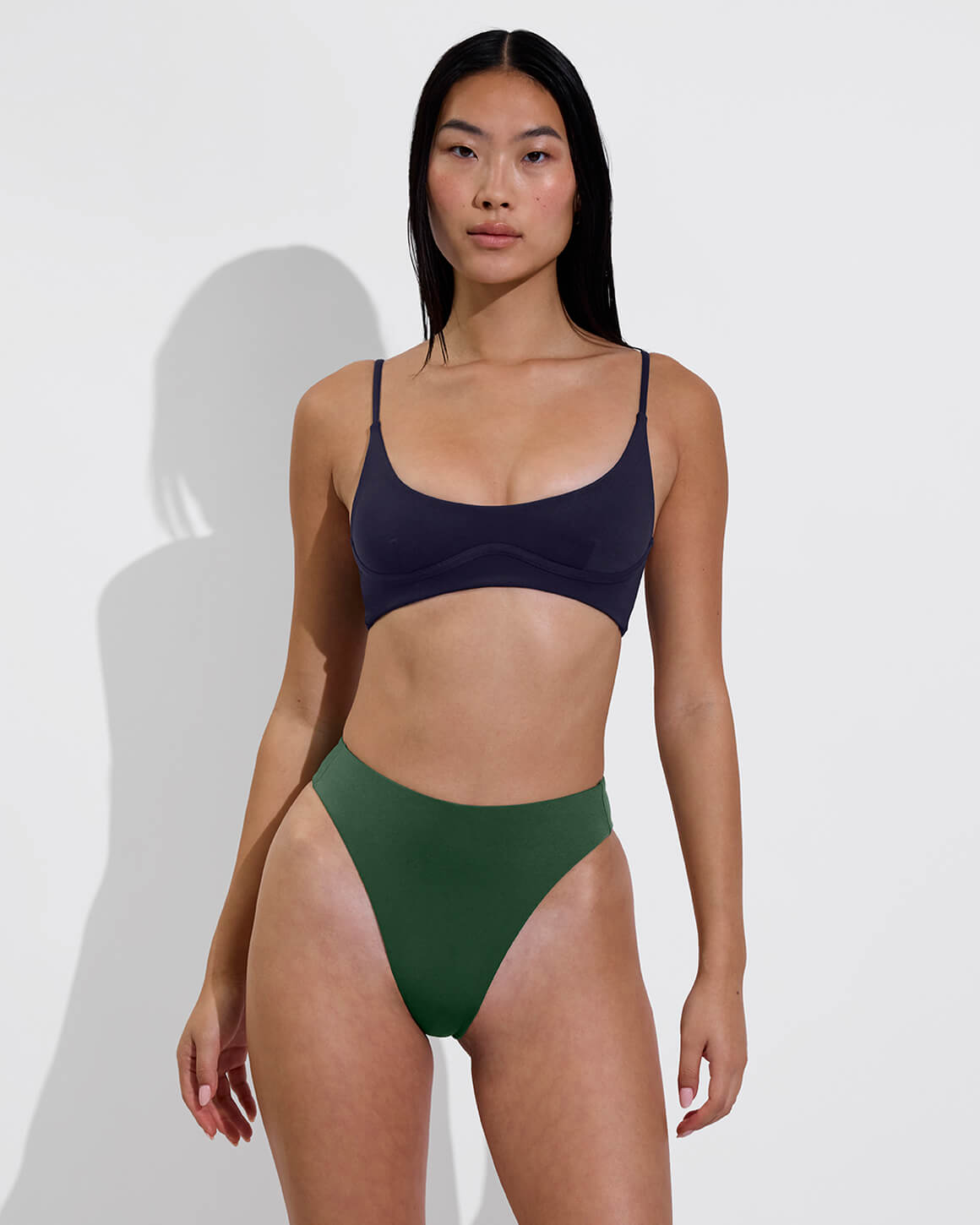 Woman in Club Top D in Sprint Paired with Throwback Bottom in Tropics