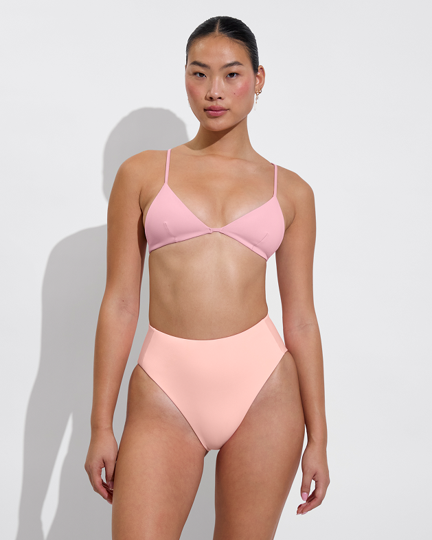 Woman in sandy top in delight paired with hi hi bottom in salt