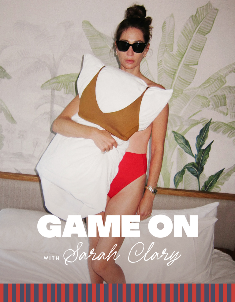 Woman in a Left On Friday swimsuit with 'Game On with Sarah Clary' text on a decorated room background