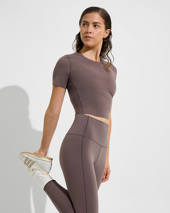 Woman in Super Moves SS tee and super moves tight in stormy