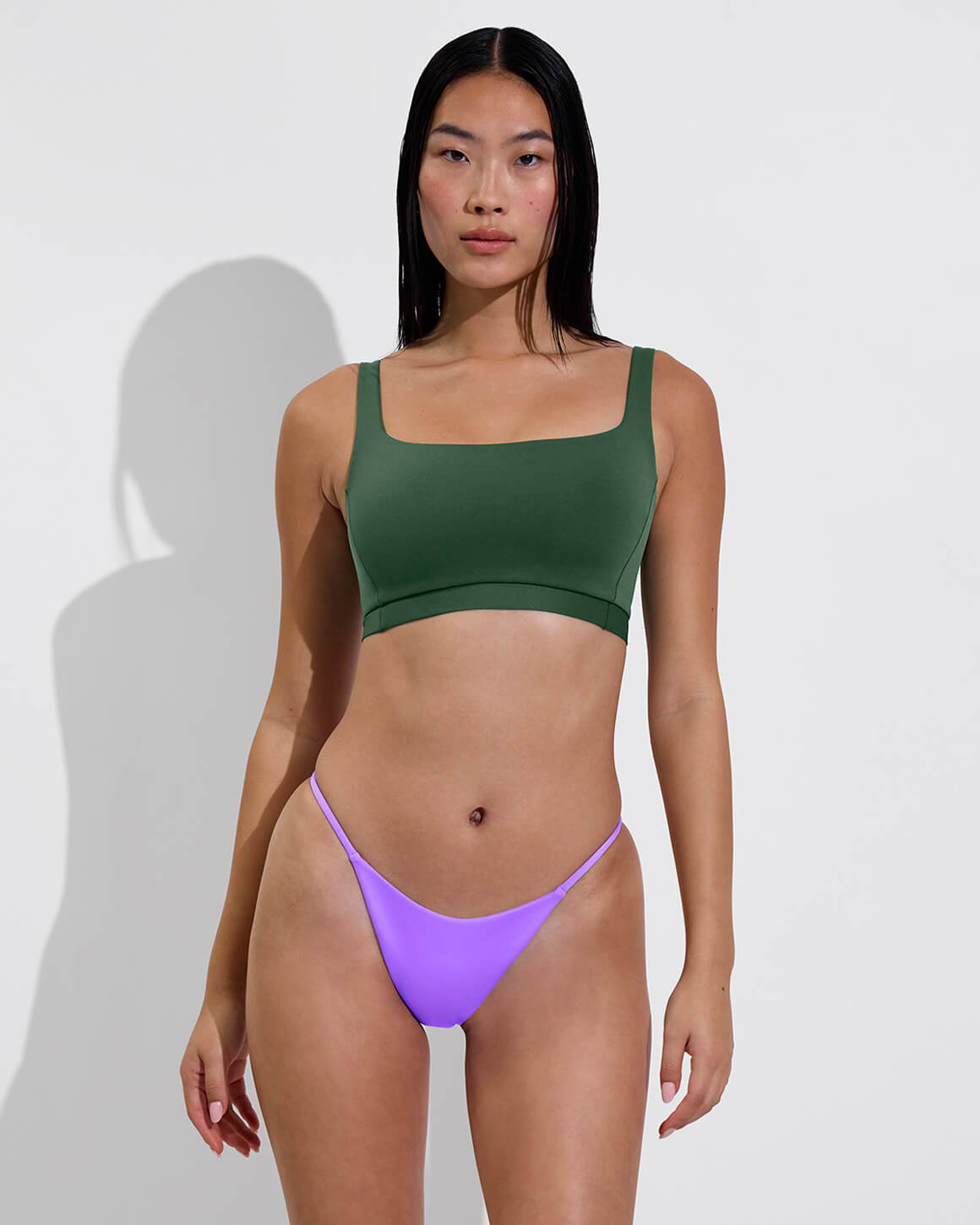 Woman in Top Shelf Top in Tropics paired with Skinny Dip Bottom in Punch