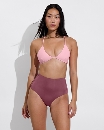 Woman in reef top in salt paired with hi tide bottom in desert plum