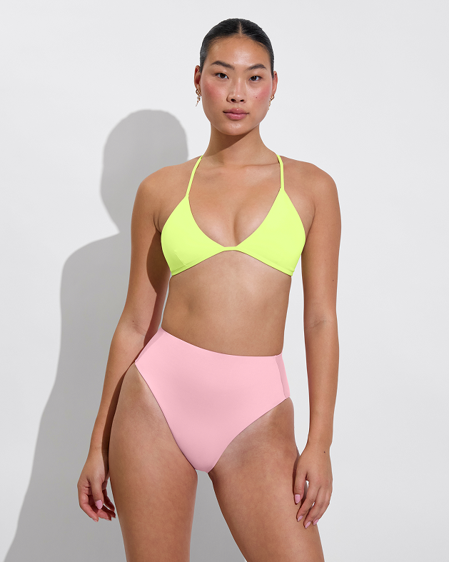 Woman in Sandy top in limoncello paired with hi hi bottom in delight