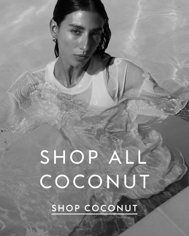 Woman in the pool wearing La crosse top with Swell Oversized Tee in Coconut