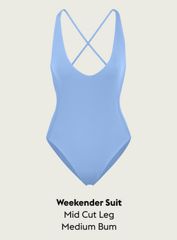 Blue Skies Weekender suit with criss-cross back design on a light gray background