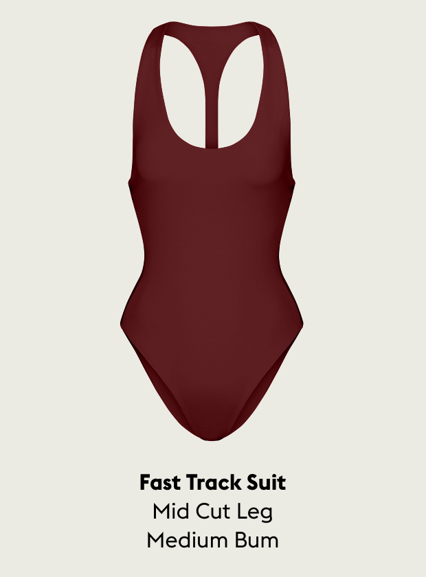 Jam (Maroon) Fast Track suit with text indicating 'Fast Track Suit Mid Cut Leg Medium Bum' on a beige background